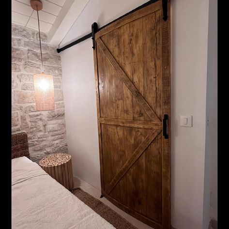 Customised with character. . A customer photo of a customised sliding barn door we made and set up in its new home in Greece. A farmhouse, barn style inspired design. Like all of our furniture, this was handmade using locally sourced timber from our workshop here on the south coast. . For unique customisations, please get in touch. Don’t forget, we ship worldwide. . #rusticfurniture #handmade #barndoor #slidingdoor #farmhousestyle #homedecor #home #homedesign #reno #homerenovation Rustic Bedroom Barn Door, Reclaimed Pine Doors, Pine Sliding Barn Door, Reclaimed Wood Barn Door, Sliding Internal Barn Doors Uk, Authentic Farmhouse, Plasterboard Wall, Barn Style Doors, Door Dimensions