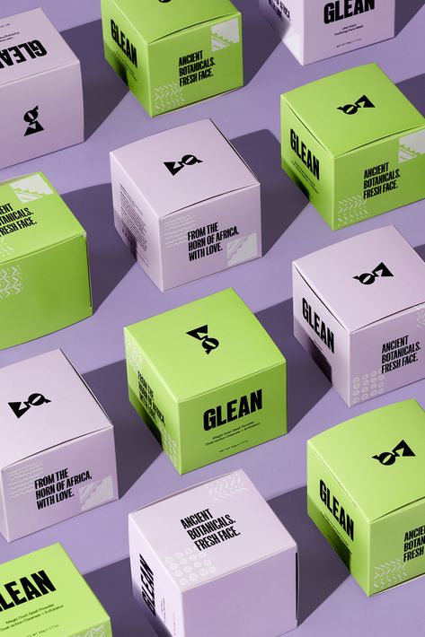 Vertical image of pastel purple and lime green skincare product packaging styled neatly in alternating pattern for Glean photoshoot by Chicago Commercial, Beauty and Fashion Photographer, Olivia Kohler. Green Box Packaging Design, Minimalist Skincare Packaging, Skincare Product Packaging, Supplement Packaging, Minimal Skincare, Green Branding, Supplements Packaging, Green Skincare, Skincare Branding