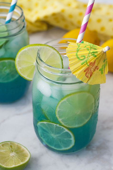 Mermaid Water Rum Punch Cocktail will make you feel like you're on a tropical island and perfect for a hot summer day. Multiply the ingredients to make a big batch for your next party or picnic! Rum Punch Cocktail, Tropical Drink Recipes, Wild Theme, Pitcher Drinks, Pitcher Cocktails, Mermaid Water, Tropical Cocktails, Punch Cocktails, Batch Cocktails