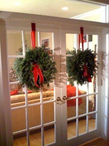 wreaths on french doors | French Doors Fresh Wreaths, Hanging Wreaths, French Holiday, Amazing Christmas Trees, Interior French Doors, Christmas Dining Room, By Regina, Ribbon On Christmas Tree, Hanging Wreath