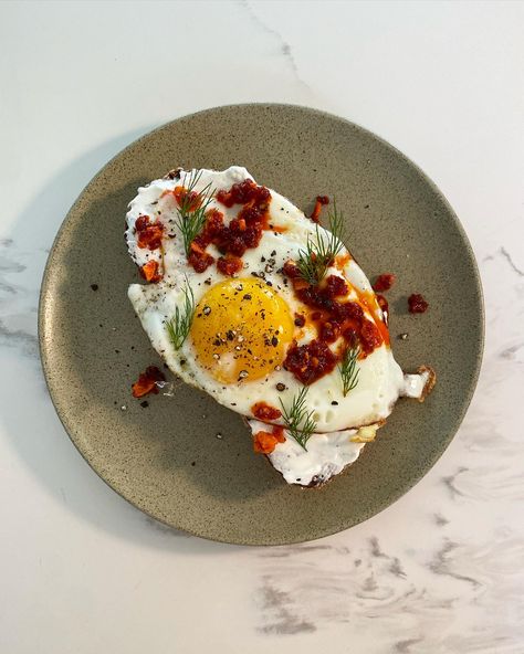 toasted sourdough with labneh, fried egg + chilli crunch Recipe by Chloe Lucas-Walsh. Labneh Breakfast, Egg Aesthetic, Eggs On Toast, Turkish Eggs, Ricotta Toast, Crunch Recipe, Aleppo Pepper, Gourmet Breakfast, Egg Toast