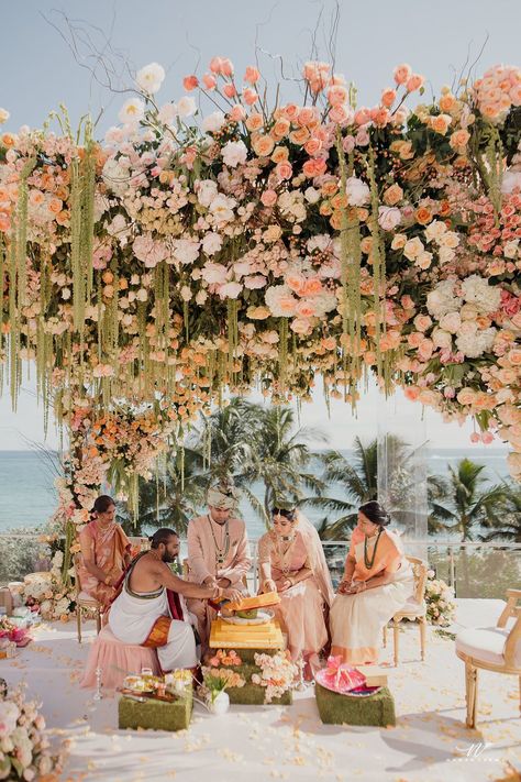 Discover 33 wedding mandap ideas from real ceremonies in settings as diverse as formal ballrooms and ocean-and-mountainside perches. Pastel, Beach Mandap Decor, Whimsical Chuppah, Indian Wedding Beach, Wedding Mandap Ideas, Outdoor Hindu Wedding, Indian Beach Wedding, Mandap Ideas, Hindu Wedding Decorations