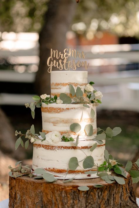 Sage and White Fairytale Wedding in the Fall #greeneryweddingcake #greeneryinspiredwedding #sagewedding #sageandwhitewedding #whiteweddingflowers #almostnakedcake #rusticfairytalewedding #rusticweddingcake #fallweddingideas Sage Green And Wood Wedding Theme, Sage Cake Wedding, Rustic Green Wedding Cake, Bohemian Sage Green Wedding, Rustic Wedding Cake Eucalyptus, Boho Wedding Cake Sage Green, Summer Sage Wedding, Rustic White Table, Sage Green Rustic Wedding Cake