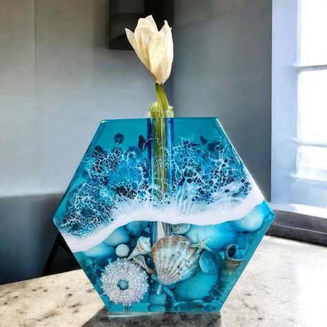 New Sea Treasures Propagation Vase 🌊 SWIPE to see the vase in action. 🌿🌻 Show off your stems in style! This vase is made from real shells and solid epoxy. It features a test tube that's removable for easy cleaning and filling with water. Find it on craftedbyrachel.com - only 1 available! 🔹@eyecandypigments - Satori White, Suiko Blue ➡️ use code Rach10 at checkout for 10% off everything on eyecandypigments.com/craftedbyrachel ➡️ link in bio • 🔹@superclearepoxy Liquid Glass & Table Top E... Propagation Vase, Glass Table Top, Glass Top Table, Test Tube, Glass Table, Easy Cleaning, Link In Bio, Table Top, Shells