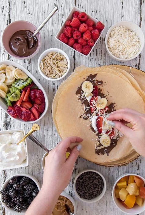 Learn how to build an epic Crepe Bar at home and be a brunch hero! Providing options for both sweet and savory crepes will have your guests raving about this unique meal idea! Crepe Buffet Ideas, Crepes Board, Crepe Bar Ideas, Crepe Station, French Lunch, Mom Brunch, Crepe Party, Crepe Bar, Crepes Party