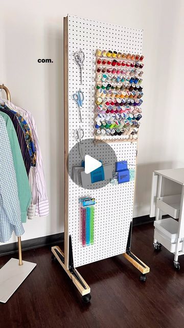 Angelina | Upcycled Fashion on Instagram: "Here’s what I used to make my mobile pegboard 👇🏾

1. 1 sheet of peg board from @homedepot cut down to 2”x6” sheets
2. 2 - 2x3”x 8’ studs cut at 6 feet
3. 4 shelf angles
4. 4 plate caster wheels

Since I was able to get all the wood cut at Home Depot, the only tool I needed was a drill.  4 hours later I had a mobile peg board thread wall. Yippee!  This is perfect for a sewing room or tool shop.

What do you think?

And I’ll leave a 🔗 to my Houston sewing classes in my Stories.
•
•
•
#diy #sewing #pegboard #sewingroom #sewingroomorganization #toolshop #learntosew #sewingforbeginners #beginnersewing #diycrafts #craftroom #diyorojects #isew #imakemyownclothes #sewsewsew #blackmakersmatter" Peg Board Wardrobe, Peg Board On Wheels, Peg Board Craft Storage, Diy Pegboard Stand, Sewing Pegboard, Craft Room Peg Board, Mobile Pegboard, Pegboard Stand, Thread Storage Ideas