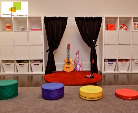 This playroom was designed for some little musicians. It also doubles theatre stage for plays! #smartplayrooms #theater #stage #playroom #music #kids #playroom #design Kids Music Corner, Playroom Stage Ideas, Diy Theater Stage, Kids Stage In Playroom, Music Playroom, Kids Play Stage, Diy Theater Room, Kids Stage Design, Dress Up Clothes Storage