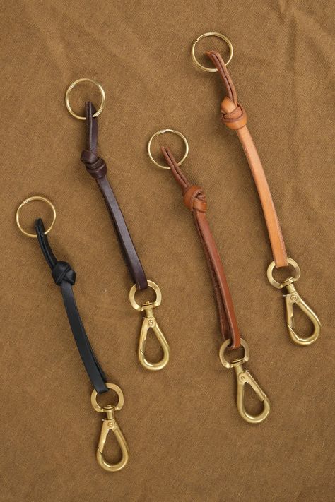 The Knot Keychain is a sleek leather key chain with a leather knot detail, and a brass loop. This can be hooked on a belt loop or on the inside of your bag for easy access to your keys. Made from a vegetable-tanned Italian leather. Leather And Wood Jewelry, Leather Things To Make, Leather Belt Ideas, Leather Bag Charm, Easy Leather Crafts, Easy Leather Projects, Scrap Leather Projects, Leather Keychain Ideas, Leather Keychain Pattern