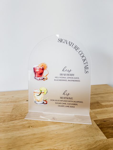 Our arch shaped frosted acrylic sign is the perfect way to add a personal touch to your wedding day! Send us your signature cocktails or your full wine list and we'll design your custom sign. Acrylic stand is included for easy tabletop display. We will match your signature drinks to watercolor illustration that match your cocktail details.​​​​​​​​​
frosted acrylic, wedding signs, wedding signage, acrylic signs, clear acrylic, bar menu sign, signature drinks sign, signature cocktails sign, bar sign Specialty Cocktails, Elegant Signature, Signature Cocktail Sign, Drinks Sign, Cocktail Illustration, Specialty Cocktail, Signature Cocktails, Cocktails Sign, Signature Drinks Sign