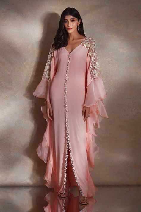 Peach kaftan featuring bead and pearl tassels along the bodice, floral sequin embroidered sheer shoulder panels and ruffle tiered sleeves. - Aza Fashions Peach Crepes, Pearl Tassels, Kaftan Designs, Kaftan Style, Winter Sun, Simple Pakistani Dresses, Abaya Designs, Arab Fashion, Designs For Dresses