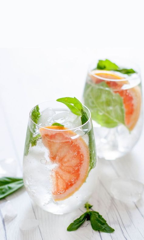 A simple two-ingredient cocktail gets a major upgrade with fresh grapefruit juice and basil. Perfectly refreshing for summer, this cocktail will have everyone convinced you’re a cocktail connoisseur.   #gin #cocktail Grapefruit Cocktail, Spritz Recipe, Prosecco Cocktails, Gin Tonic, Alcohol Recipes, Gin And Tonic, Summer Cocktails, Party Drinks, Cocktail Drinks