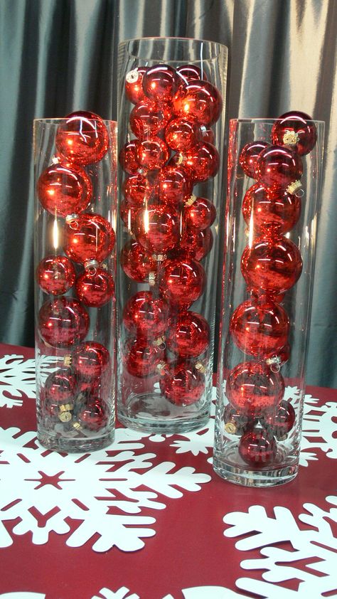 I love plain Christmas Balls in clear vases....we played with all red, in a trio of vases, with different sizes of red. Lovely! Vase With Christmas Ornaments, Red Christmas Party Theme, Formal Christmas Party Decorations, Kim K Christmas, Company Christmas Party Decorations, Teacher Party Ideas, Red And Gold Christmas Party, Red And White Christmas Party, Red And Green Christmas Party