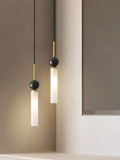 The Marble Elegance Vertical Pendant marries minimalist design with luxurious materials, creating a sophisticated statement piece for any contemporary space. This pendant features a sleek brass rod that gracefully suspends a striking marble sphere, epitomizing a balance of strength and beauty. Below the marble, an elongated acrylic diffuser emits a soft, warm glow, resembling a pillar of light that adds depth and ambiance to the room. This fusion of marble's natural patterning with the clear, modern lines of acrylic and the timeless luster of brass forms a lighting piece that is both a source of light and a sculptural work of art. 
 If you have any questions about our products, please contact us and we will reply to you within 24 hours. 
 >>> 
 
 Product Size 
 1 Head Size: Dia 6c Hanging Vanity Lights, Bathroom Pendant Lights Over Vanity, Marble Lighting, Marble Sphere, Powder Room Lighting, Brass Rod, Bathroom Lamp, Bathroom Pendant, Bathroom Pendant Lighting