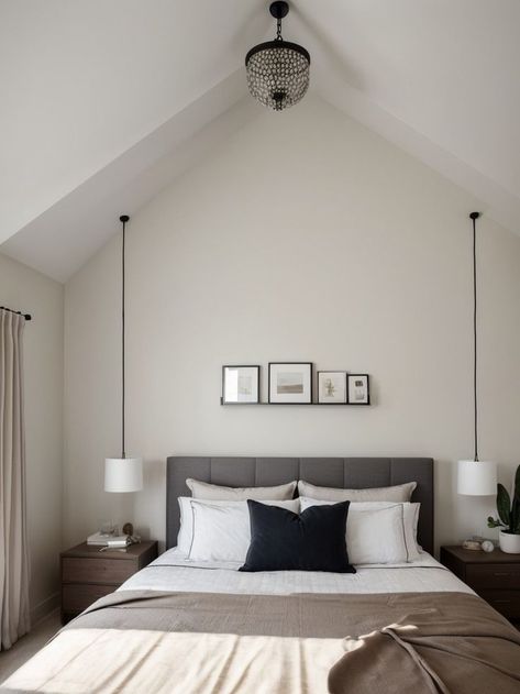 Create an inviting bedroom with a statement pendant light fixture, suspended from the vaulted ceiling above the bed. Complement the modern look with a sleek platform bed and minimalist decor for a chic and sophisticated space. Ideas For Vaulted Ceilings, Vaulted Ceiling Bedroom, Island Lighting Ideas, Inviting Bedroom, Bedroom Pendant, Suspended Lighting, Vaulted Ceilings, Statement Pendant, Vaulted Ceiling