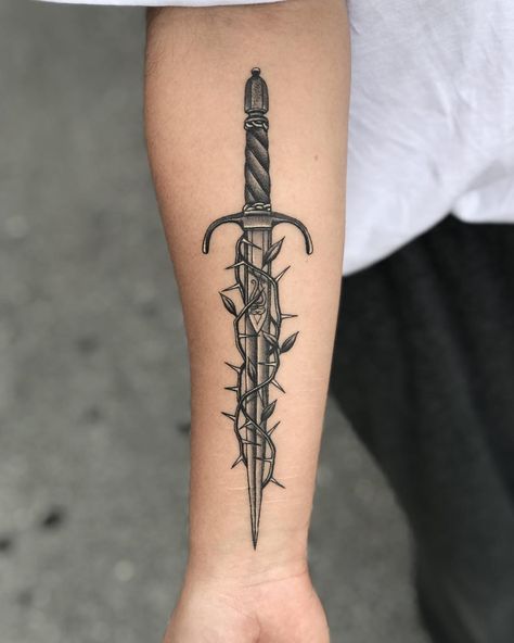 Dagger and thorns tattoo by Javier Betancourt inked on the right forearm Small Dagger Tattoo, Traditional Dagger Tattoo, Thorn Tattoo, Tato Tradisional, Knife Tattoo, Forearm Band Tattoos, Fire Tattoo, Dagger Tattoo, Forearm Tattoo Men