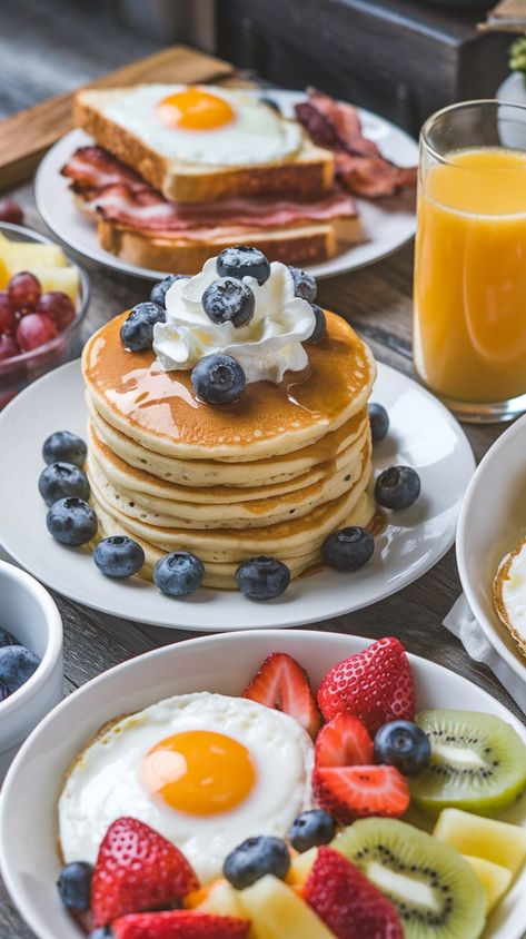 "Start your day right with this mouthwatering breakfast spread! Enjoy fluffy pancakes topped with fresh blueberries and whipped cream, paired with a sunny-side-up egg, crispy bacon, and a colorful assortment of fresh fruits like strawberries, kiwi, and pineapple. Perfect for a cozy weekend brunch or a delightful breakfast treat. Find more breakfast inspiration and recipes on our board!" Breakfast Pictures Aesthetic, Fancy Breakfast Aesthetic, Pancakes Bacon And Eggs, Breakfast Ideas Pancakes, Fancy Pancakes, Pancakes Aesthetic, Twenty Fine, Delicious Breakfast Ideas, Breakfast Spread