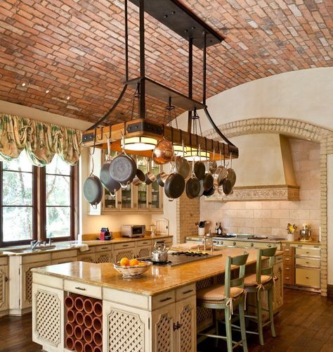 Pots and pans hanging over kitchen island. Love brick ceiling. Pot Rack Kitchen, Rustic Italian Decor, Pan Hanger, Vaulted Ceiling Kitchen, Diy Storage Rack, Hanging Pans, Pot Rack Hanging, Mediterranean Kitchen, Brick Kitchen