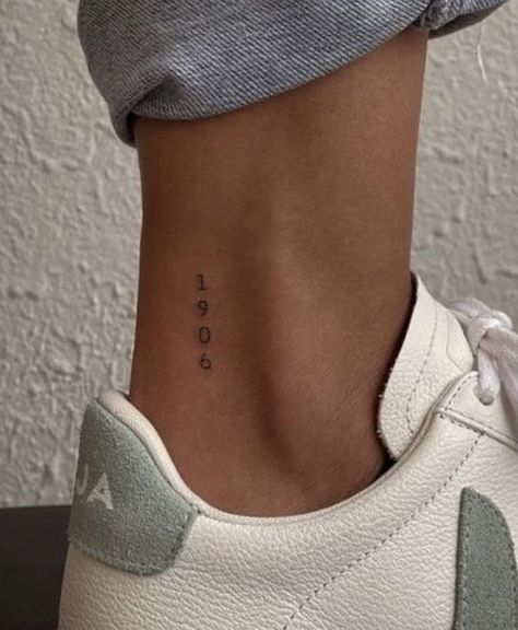 Tiny Tattoo Neck, Year Ankle Tattoos For Women, Words On Ankle Tattoo, Minimal Tattoo Placement Ideas, Small Dainty Tattoo Placement, Tiny Date Tattoos, Paris Tatoos, Year Tattoo On Ankle, This Is Art Tattoo