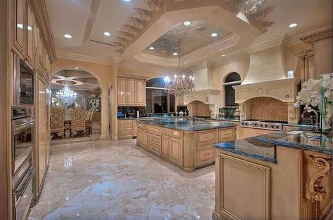 This giant kitchen has plenty of cupboard space, a large chandelier, elegant styling and a whole lot more. With the marble floors and giant stove you've got something super high end here. Interior Design Per La Casa, Luxury Kitchen Design, Luxury Homes Dream Houses, Luxury Kitchens, Large Kitchen, Counter Tops, Decor Minimalist, House Goals, Dream Rooms