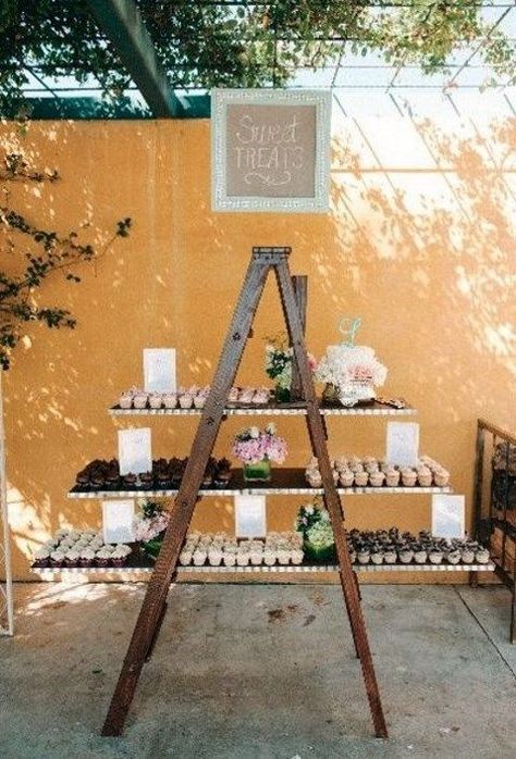 A ladder may be a very useful piece in your wedding decor, and here are some ways to use it. First of all, a ladder is a perfect display for any kind... Ladder Wedding, Wedding Food Display, Rustic Country Wedding Decorations, Ladder Display, Country Wedding Decorations, Cupcake Stands, Vintage Dessert, Cupcake Display, Cupcake Stand