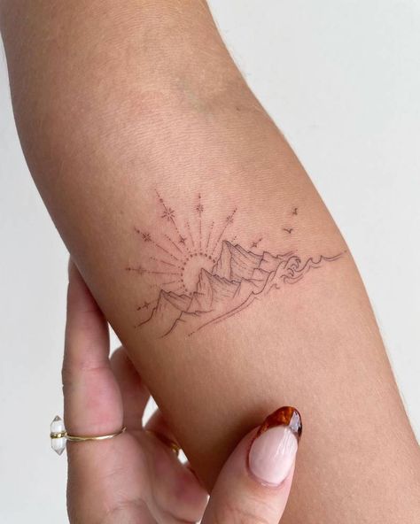 Fine line sunset and mountains tattoo on the inner Moutain Tattoos, Mountain Tattoos, Sunset Tattoos, Hiking Tattoo, Muster Tattoos, Elbow Tattoos, Petite Tattoos, Tattoos Geometric, Sun Tattoos