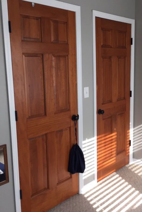 Wood stained doors, aged bronze door knobs, white trim, Woodlawn colonial paint from Valspar Wood Doors White Trim, Cedar Door, Bronze Door Knobs, Black Door Knobs, Stained Doors, Brown Doors, Oak Trim, Interior Painting, Front Door Colors