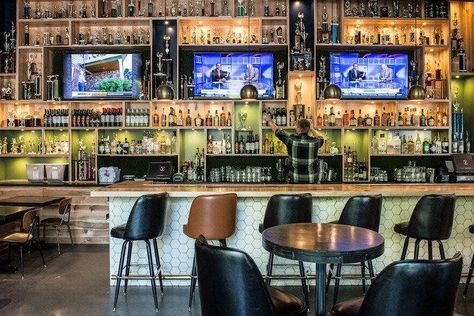 American Sports Bar, Back Bar Design, Sport Bar Design, Sports Pub, Sports Bars, Exposed Rafters, Projection Screens, Foosball Table, Bar And Restaurant