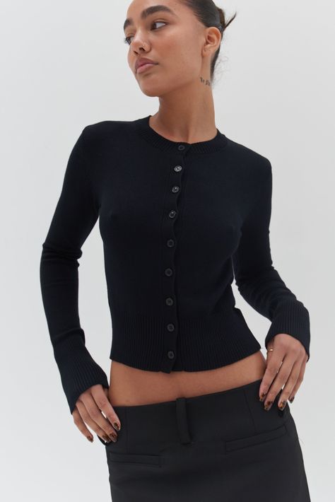 A cozy wardrobe essential! Our Camille Cardigan - Black is crafted from a soft black knit; featuring - a classic button-up front, slightly cropped length and finished with ribbed detailing to the hem, cuffs and neckline Therapist Aesthetic, 6th Form Outfits, Cozy Wardrobe, Trendy Fashion Accessories, Fitted Cardigan, Cardigan Style, Elevated Basics, Cardigan Outfits, Cardigan Black