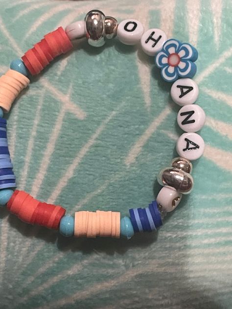 Lilo and stich clay bead design Disney Themed Clay Bead Bracelets, Lilo And Stitch Clay Bead Bracelets, Stitch Clay Bead Bracelet, Disney Clay Bead Bracelets Ideas, Lilo And Stitch Bracelet, Squishmallows Birthday, Disney Dance, Make Clay Beads, Pandora Bracelet Designs