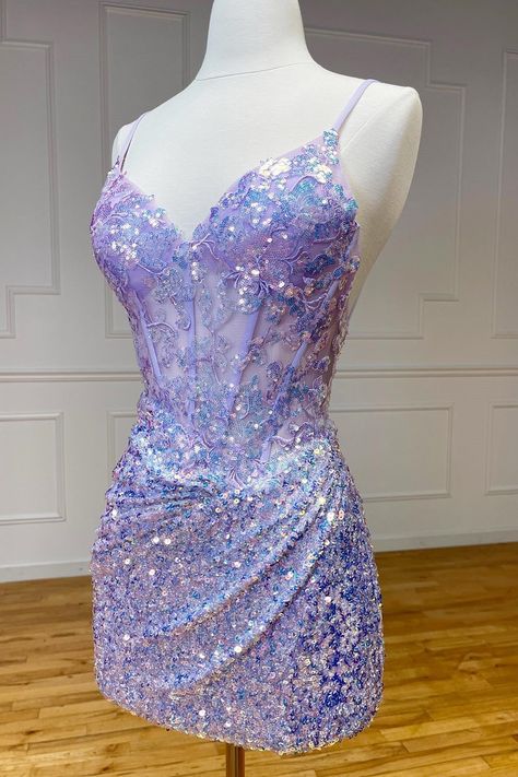 Othello, a dazzling sheath-style homecoming dress in sequin fabric. Available in Purple, Lilac, Green, and Lavender, adorned with shimmering appliques and sequins with a flattering V-neckline and sleeveless design. Complete with a zipper back, Othello is perfect for making a statement with its shimmering elegance and vibrant hues.   Details:     Silhouette: Sheath Style    Fabric: Sequin Fabric    Color: Purple, Lilac, Green, Lavender Color    Length: Short-Mini Length    Neckline: V-Neck    Sle Pretty Prom Dresses Mini, Winter Sweet 16 Dresses, Purple Sweet Sixteen Dresses, Sweet 16 Dresses Purple, Purple Homecoming Dress Short, Purple Birthday Dress, Lilac Homecoming Dress, Short Purple Dress, Purple Hoco Dress