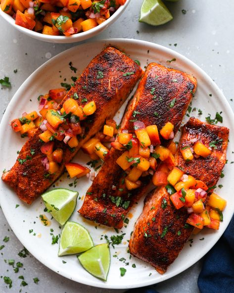 Salmon fillets are rubbed with a smoky chipotle seasoning, baked to perfection and topped with the best homemade peach salsa! They're so easy to make and the perfect blend of sweet and spicy! Chipotle Salmon, Oven Baked Salmon Recipes, Chipotle Seasoning, Oven Baked Salmon, Easy Summer Dinners, Salsa Ingredients, Peach Salsa, Shrimp Ceviche, Cilantro Lime Dressing