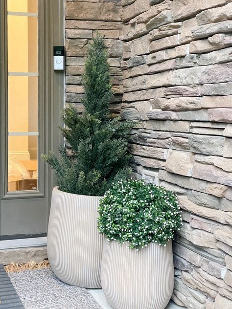 Faux greenery front porch plants planters Amazon viral at home Follow my shop @yourdesignerbff on the @shop.LTK app to shop this post and get my exclusive app-only content! #liketkit #LTKhome @shop.ltk https://liketk.it/4rDxx Front Porch Plant Hanger, Fake Plants Front Porch, Front Door Corner Decor, Large Planters In Front Of House, Front Porch Planter Ideas Artificial, Front Porch Planter Ideas Entrance, Fake Outdoor Plants Front Doors Porch, Front Door Faux Planter Ideas, Large Planters Front Porch