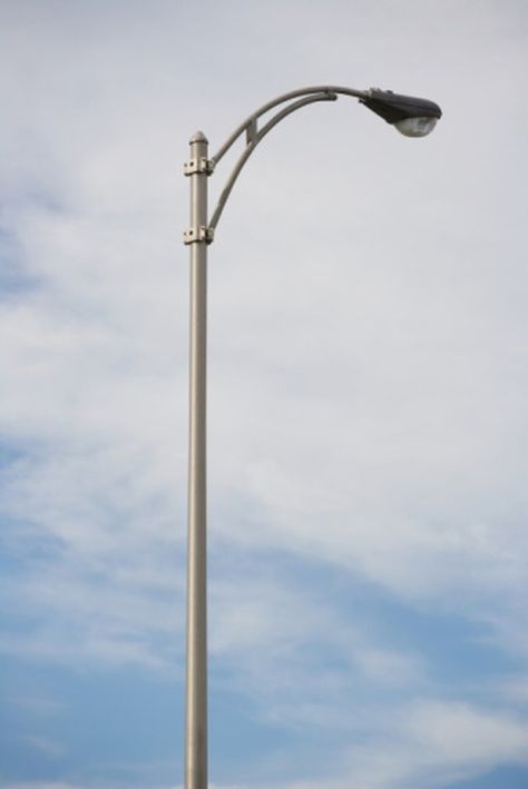 A leaning pole is usually indicative of soil erosion or shift, and the angle of the lean grows progressively acute as the soil around the pole erodes or shifts further. Nature Alphabet, Street Lamp Post, Lighting Your Garden, Downtown Buildings, Outdoor Lamp Posts, Light Lamps, Led Street Lights, Light Pole, Street Lights