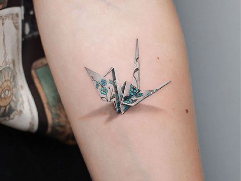 Tiny Floral Origami Tattoo Paradox Tattoo, Blue Ink Tattoos, Mario Tattoo, Origami Tattoo, Shadow Tattoo, Cute Simple Tattoos, Bottle Tattoo, Blue Tattoo, Shark Tattoos