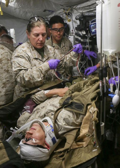 A U.S. Navy trauma nurse with Combat Logistics Battalion (CLB) 26, 26th Marine Expeditionary Unit (MEU), practices transfusing blood to a simulated casualty during casualty care training at Fort Pickett, Va., April 21, 2015. CLB 26 practiced the handling, care and transportation of wounded personnel as the 26th MEU conducted a mock raid. The 26th MEU and its supporting elements are conducting realistic urban training in preparation for deployment to the 5th and 6th Fleet areas of responsibil... Navy Nurse Corps, Military Nurse, Driver Card, Army Tent, Army Medic, Iphone Screen Repair, Never Give Up Quotes, Army Nurse, Army Images