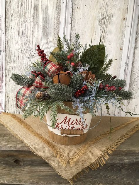 Santa Centerpiece, Holiday Centerpieces Christmas, Greenery Christmas, Wood Tote, Winter Arrangements, Winter Centerpieces, Christmas Bucket, Rustic Holiday Decor, Christmas Floral Arrangements