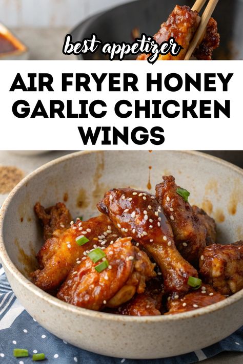 A close-up of a bowl filled with golden and crispy air fryer honey garlic chicken wings, garnished with sesame seeds and chopped green onions. A pair of chopsticks is holding one wing, highlighting the glistening honey garlic sauce. The background features a blurred kitchen setting, creating a cozy and appetizing vibe. Air Fryer Honey Garlic Chicken, Wings Airfryer, Air Fryer Lunch Recipes, Gluten Free Air Fryer Recipes, Air Fryer Lunch, Gluten Free Chicken Tenders, Honey Garlic Wings, Air Fryer Chicken Breast, Honey Garlic Chicken Wings