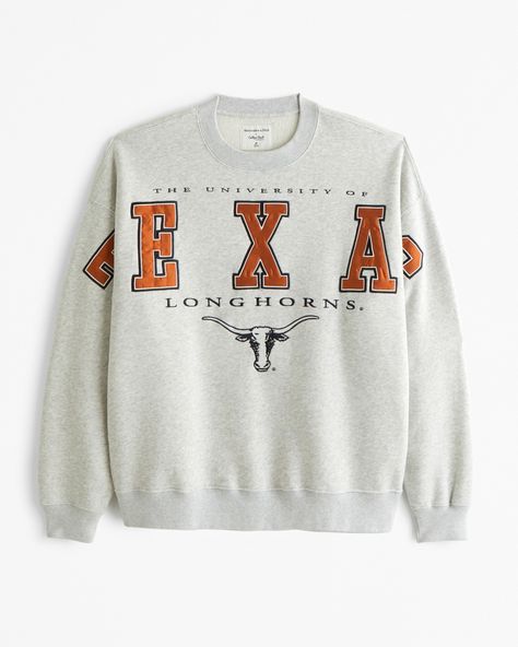 Classic sweatshirt in our softAF fleece fabric and oversized-fit silhouette, featuring University of Texas-inspired graphic detail at chest and sleeves, crew neckline and banded hem and cuffs. Vintage High School Sweatshirt, Vintage College Crewneck, College Merch Ideas, Little Top Big Pants, Male Design, Texas Graphic, Skort Dress, Male Style, Classic Sweatshirt