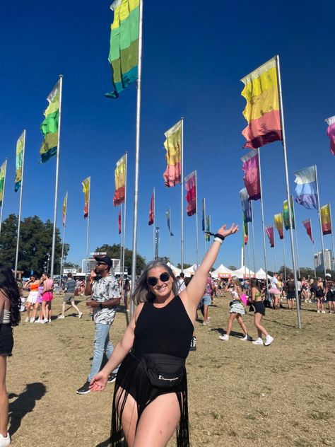 Midsize girl standing in front of a row of flags at a festival. She has one arm out to the sky and the other by her side, wearing a black fringe body suit. Midsize Festival Fashion, Music Festival Outfits Midsize, Festival Outfit Midsize, Summer Music Festival Outfits, Acl Festival, Festival Inspo, Summer Music Festivals, Music Festival Outfits, Coachella Outfit