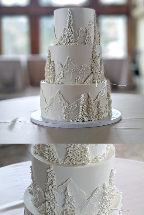 3 Tier white wedding cake with mountains and trees in relief. Wedding Cake Designs Winter, Wedding Cake With Mountains, Ski Wedding Cake, Two Tier Winter Wedding Cake, Winter Wedding Cake 2 Tier, Cake With Mountains, Snow Wedding Cake, Wedding Cake Mountain, White Mountain Wedding Cake