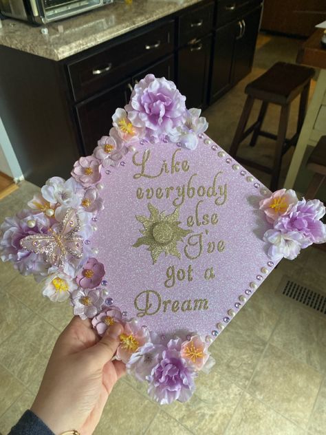 Cap Decoration Graduation Princess, Slipping Through My Fingers Grad Cap, Star Grad Cap Ideas, Repunzle Graduation Cap, College Hats Graduation Caps, Grad Caps With Bows, Extra Graduation Cap, Grad Cap Designs Tangled, Grad Cap Ideas Business Major