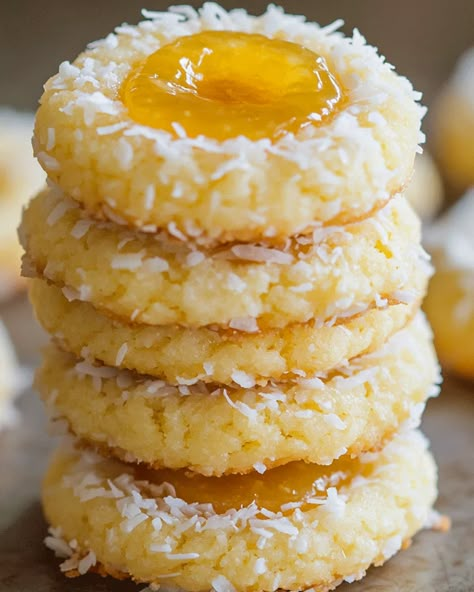 Hello, and Welcome to a Tropical Treat! If you’re craving something tropical and sweet, you’re in the right place! These Coconut Thumbprint Cookies with Pineapple Filling are like a mini-vacation in each bite, featuring a buttery, melt-in-your-mouth cookie with the sunny taste of pineapple nestled in each thumbprint. Thumbprint Cookies With Coconut, Pineapple Coconut Thumbprint Cookies, Hawaiian Christmas Desserts, Tropical Christmas Cookies, Pineapple Cookies Recipes, Pineapple Filled Cookies, Coconut Christmas Cookies, Pineapple Upside Down Cookies, Pineapple Coconut Dessert