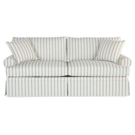 Upholstered in neutral-hued Sunbrella-a high-performance fabric that repels stains, spills, mold, and bacteria-this skirted sofa is guaranteed to remain crisp and clean for years to come. And because it's bolstered to a kiln-dried hardwood frame and amply padded with high-density foam enveloped in a blanket of fiber and fabric tick, it boasts equal parts style and comfort. Two matching throw pillows included. Handcrafted in the USA. Blue Striped Couch, Blue Fabric Armchair, Dorm Couch, Striped Couch, Coastal Sofa, Skirted Sofa, Neutral Sofa, Striped Sofa, White Couches