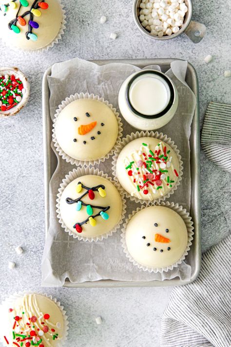 Christmas hot cocoa bombs decorated 3 different ways: jolly snowman, string of lights, and truffle-style hot chocolate balls. They're arranged on a metal tray with a glass bottle of milk and extra marshmallow bits and Christmas sprinkles. Hot Chocolate Balls, Homemade Hostess Gifts, Easiest Recipes Ever, Easy Christmas Candy, Easy Christmas Candy Recipes, Christmas Bakes, White Chocolate Candy, Gluten Free Candy, Hot Chocolate Bomb