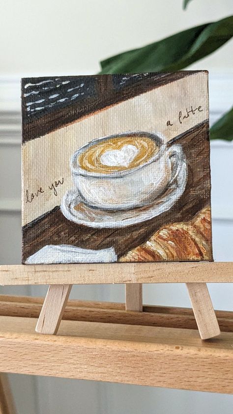 A 3x3 handmade painting of a latte on a cafe table! Notes:  - 3x3 inches - Acrylic paint - On stretched canvas  - Signature included on back - Completely handmade so each order may vary Thanks for stopping by! Small Canvas Paintings For Kitchen, Gifting Painting Ideas, A3 Canvas Painting Ideas, Coffee Bar Painting Ideas, Coffee Aesthetic Painting, Cafe Painting Ideas, Theme Painting Ideas, Painting Ideas Coffee, Girlfriend Painting