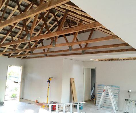 Want exposed beams in your house? Here's how... Trussed Ceiling Exposed Beams, Exposed Wood Trusses Ceiling, Vaulted Truss Ceiling, Exposed Garage Ceiling, Partial Vaulted Ceiling Living Room, Roof Beams Exposed, Exposing Beams Ceiling Diy, Ceiling Trusses Exposed, Roof Truss Design Exposed Beams