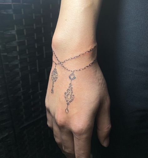 reeze 🕊️ | Bracelet + charms decor for Dylan 🤍 Such a fun placement to do thank you so much !! | Instagram Bracelet Hand Tattoo, Braclet Tattoo, Charm Bracelet Tattoo, Bracelet Tattoo, Tattoo Bracelet, Bracelet Charms, Hand Tattoo, Thank You So Much, Hand Tattoos