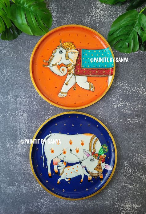 Pichwai theme decorative elephant and kamdhenu painting on 10 inches diameter wall plate. They both going so well together as a combo. Kamdhenu Painting, Pichwai Elephant, Painting Elephant, Pichwai Painting, Pichwai Paintings, Elephant Painting, Cow Painting, Elephant Decor, Origami Crafts Diy