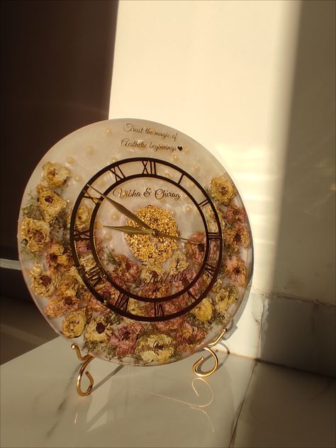 A resin clock made from Varmala roses is a unique and sentimental keepsake that preserves the roses from a wedding garland (Varmala). Varmala Preservation Ideas, Varmala Preserve In Resin, Rose Preservation, Wedding Preservation, Varmala Preservation, Resin Watch, Resin Clock, Desi Wedding Decor, Wedding Garland