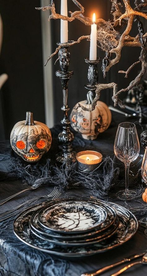 Create a wickedly elegant Halloween table with these decoration ideas! Use a black sequin tablecloth for a touch of glamour. Add gold skull centerpieces surrounded by deep purple flowers. Place ornate gothic candelabras with black tapered candles. Use spider web placemats and napkin rings adorned with tiny bats. Add vintage potion bottle name cards for each guest. These sophisticated Halloween table decorations will cast a spell of enchantment on your dinner party! Candelabra Halloween, Deep Purple Flowers, Sophisticated Halloween, Black Taper Candles, Tapered Candles, Sequin Tablecloth, Halloween Table Decorations, Elegant Halloween, Halloween Dinner